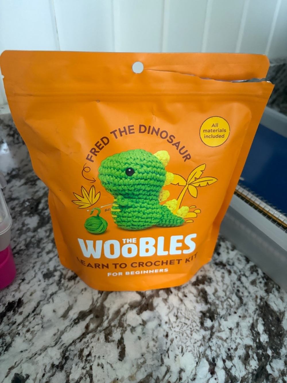The Woobles Fred the Dinosaur Learn to Crochet Kit - Orange Packaging